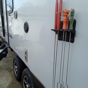 Roasting stick holder for camper outside PAW style tv mount.